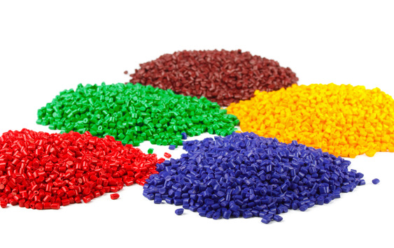 Colourful plastic polymer granules isolated on white